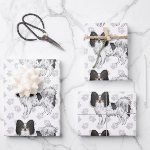 Tricolor-Papillon-Cartoonhunde mit einem Pfotenmus Geschenkpapier Set