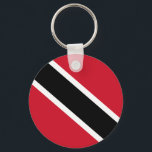Trinidad und Tabago Schlüsselanhänger<br><div class="desc">Die Flagge von Trinidad und Tobago wurde nach der Unabhängigkeit vom Vereinigten Königreich am 31. August 1962 adoptiert. Rot,  Schwarz und Weiß symbolisieren das Feuer (die Sonne,  die den Mut darstellt),  die Erde (die Widmung darstellt) und das Wasser (die Reinheit und Gleichheit repräsentiert).</div>