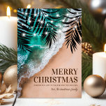 Tropical Beach Weihnachtskarte Feiertagskarte<br><div class="desc">Elegante Strandurlaubskarte mit tropischem Sandstrand,  Meereswellen,  romantischen Blätter aus Palmen,  Lichtern,  Frohen Festtagen und Ihrem Namen.</div>