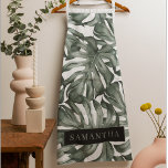 Tropical Watercolor Modern Oasis Leaves Schürze<br><div class="desc">Die neue Kollektion Tropical Watercolor Moderne Oasis Blätter Muster ist ab sofort auf Zazzle erhältlich! Tauchen Sie ein in die lebendige Schönheit der Natur mit diesen atemberaubenden Produkten, die eine zeitgenössische Drehung auf tropischem Laub bieten.Wählen Sie aus einer großen Auswahl an Produkten, um Ihre Bedürfnisse und Ihren persönlichen Stil zu...</div>