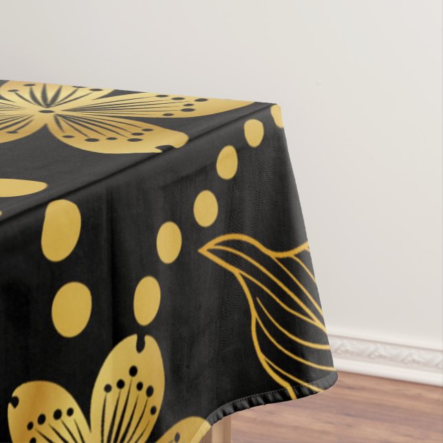 tropische Blätter und Blume in Gold auf schwarz Tischdecke (Beispiel)