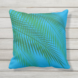 Tropische Palmblätter auf dem blauen Himmel - im Kissen