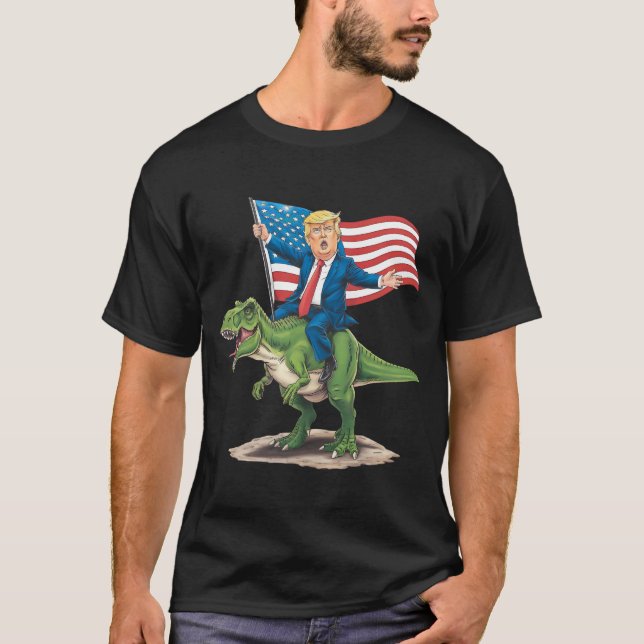 Trump Riding Dinosaur T Rex US-amerikanische Flagg T-Shirt (Vorderseite)