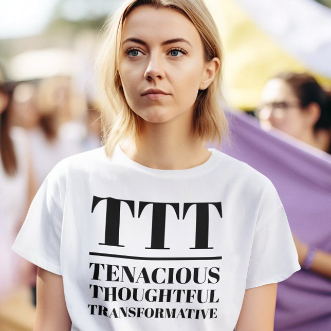 TTT- leichtsinnig, nachdenklich, transformativ T-Shirt (Woman wears a "TTT: Tenacious, Thoughtful, Transformative" white t-shirt.)