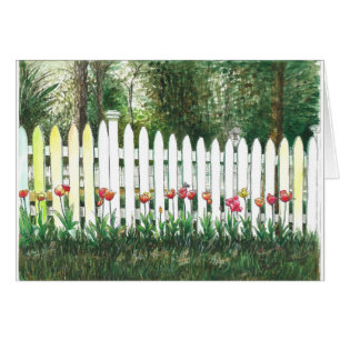Tulpen durch den weißen Zaun