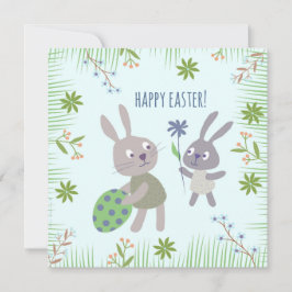 Twee paashaasjes met ei en bloem. karte