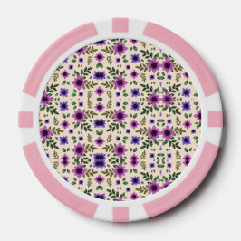 Two poker chips with pink borders and intricate 