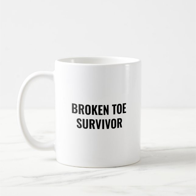 Überlebender eines gebrochenen Zehs Lustiges Gesch Kaffeetasse (Links)
