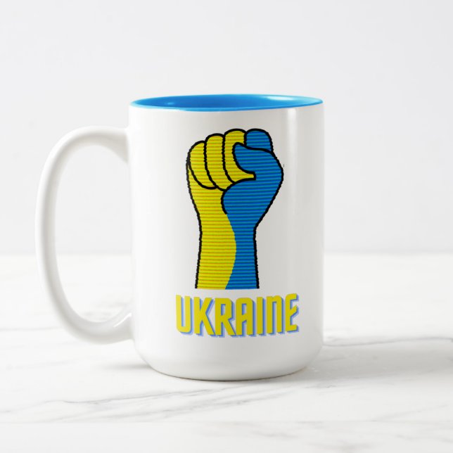Ukraine trotzige Faustschild Zwei-Tonen-Kaffee-Tas Zweifarbige Tasse (Links)