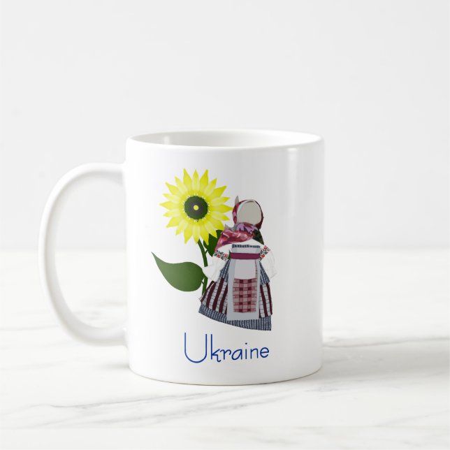 Ukrainische Volkspuppe mit Sonnenblume, Motanka. Kaffeetasse (Links)