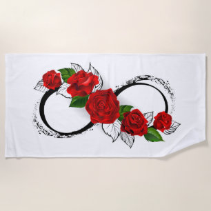Unendlichkeitssymbol mit roten Rosen Strandtuch