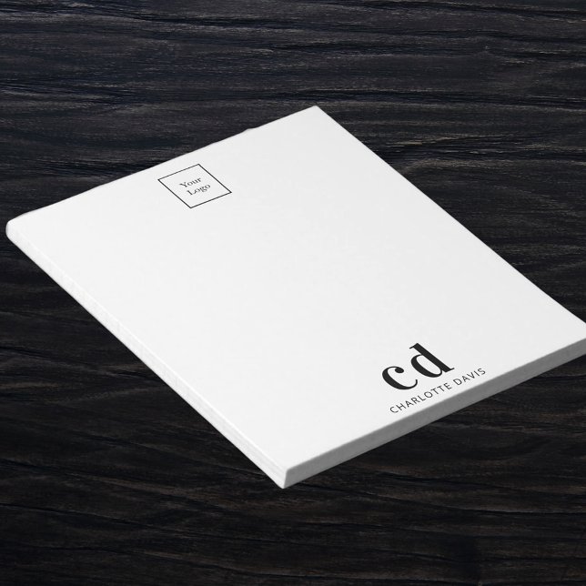 Unternehmen mit weißem Logo und schwarzem Monogram Notizblock (Von Creator hochgeladen)