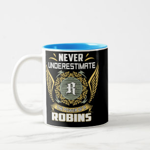 Unterschätze nie die Macht eines Rotkehlchens Zweifarbige Tasse