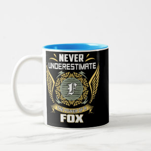Unterschätze niemals die Macht eines Fuchses Zweifarbige Tasse