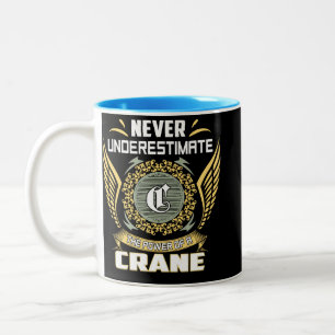 Unterschätze niemals die Macht eines Krans Zweifarbige Tasse