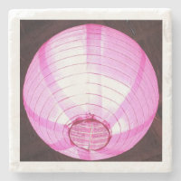 Untersetzer aus Stein mit subtilem rosa Licht