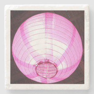 Untersetzer aus Stein mit subtilem rosa Licht