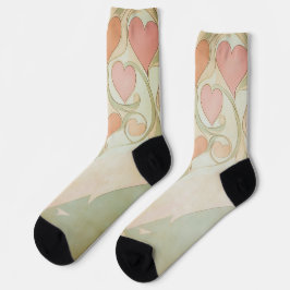 Valentinherzen im Hintergrund in hellrosa und grün Socken
