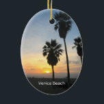 Venice Beach California Keramikornament<br><div class="desc">Dieses Foto zeigt große Palmen in der Silhouette,  stehend gegen einen herrlichen,  lebhaften,  gelben,  orangefarbenen und roten Sonnenuntergang über dem Pazifischen Ozean in Venice Beach,  Kalifornien. Fügen Sie optionalen Text oder Ihre Urlaubstermine für ein einzigartiges Souvenir hinzu. Ein weiteres exklusives Design von Sonja Quidama Image Code: sfvbs</div>