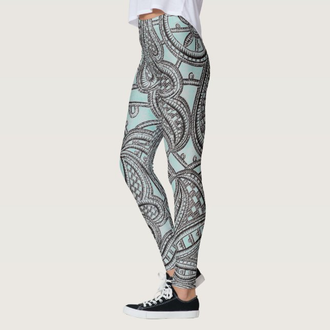 Verzierte schwarze Spitze und aquamarines Muster Leggings (Links)