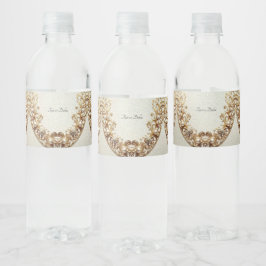 Verziertes goldenes Wasserflaschenetikett mit Schn