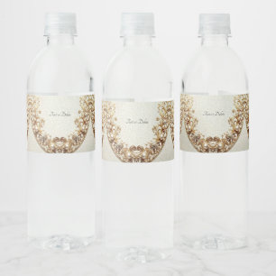Verziertes goldenes Wasserflaschenetikett mit Schn