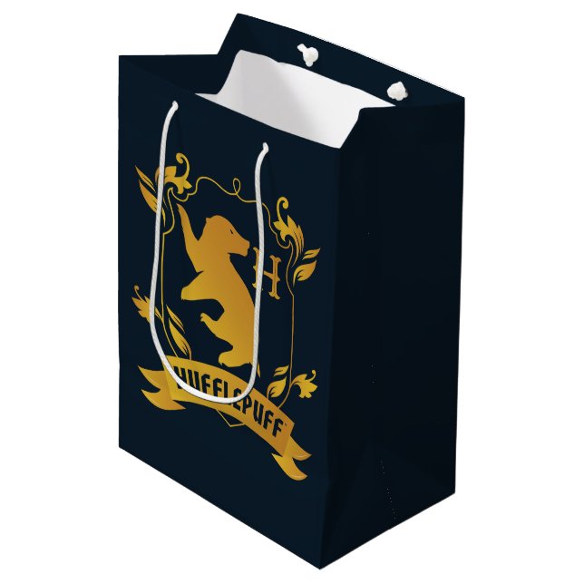 Verziertes HUFFLEPUFF™-Wappen Mittlere Geschenktüte (Vorderseite Schrägansicht)