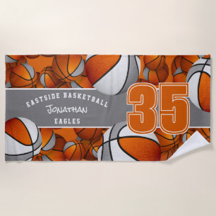 Viele Basketbälle mit orangegrauen Teamfarben Strandtuch