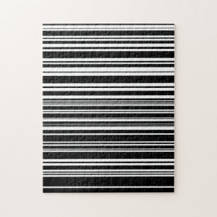 Vielzahl ungleichmäßiger Schwarz-Weiß-Streifen Puzzle