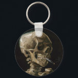 Vincent van Gogh Art Schlüsselanhänger<br><div class="desc">Vincent van Gogh (Niederländisch, 1853 - 1890) Schädel eines Skeletts mit brennender Zigarette, 1885-86, Öl auf Leinwand Ungerahmt: 32 cm × 24, 5 cm (13 in × 9, 6 in) Früharbeit von Vincent van Gogh. Dieses kleine Gemälde ist Teil der ständigen Sammlung des Van Gogh Museums in Amsterdam. Es wurde...</div>