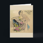 Vintag - Happy Birthday Mother Karte<br><div class="desc">Eine Vintage Geburtstagskarte für eine Mutter bietet eine raffinierte und modische Dame, die sich mit einer Tasse Tee oder Kaffee entspannen kann. Neben ihr auf einem Tisch sind ein paar rosa Rosen. Auf der Vorderseite der Karte steht: "Happy Birthday Mother Lieber" und die Botschaft in der Karte lautet: "Eine besondere...</div>
