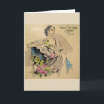Vintag - Happy Birthday Mother Karte<br><div class="desc">Eine Vintage Geburtstagskarte für eine Mutter bietet eine raffinierte und modische Dame, die sich mit einer Tasse Tee oder Kaffee entspannen kann. Neben ihr auf einem Tisch sind ein paar rosa Rosen. Auf der Vorderseite der Karte steht "Happy Birthday Mother Dear" und die Meldung in der Karte lautet: "Eine besondere...</div>