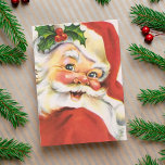 Vintag Holly Jolly Santa Claus Custom Christmas Feiertagskarte<br><div class="desc">Die Weihnachtskarte aus der Mitte des Jahrhunderts ist mit einem heiligen, fröhlichen Weihnachtsmann mit Kirschnase, roten Wangen, rotem Anzug und Hut, einem Augenzwinkeln und einem Funken Misteloe ausgestattet. Sentiment in der Karte lautet: "Möge Ihre Ferienzeit mit Liebe und Freude gefüllt werden. Frohe Weihnachten!" und kann nach Wunsch geändert oder bearbeitet...</div>