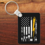 Vintage American Flag Lineman Electrician Tools Schlüsselanhänger<br><div class="desc">Whether they’re climbing poles in a storm or maintaining the grid, an electrician’s job is never done. This distressed, patriotic design on a keychain celebrates the skill and bravery of powerline workers. Featuring a retro aesthetic with a focus on the tools of the trade and the Stars and Stripes, this...</div>