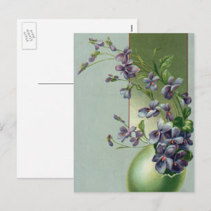 Vintage blühende violette Blumen in einem Osterei Feiertagspostkarte