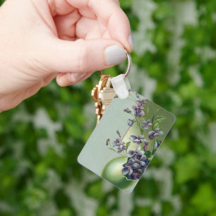 Vintage blühende violette Blumen in einem Osterei Schlüsselanhänger