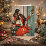 Vintage Christmas Doorstep Illustration Karte<br><div class="desc">Celebrate the charm of a classic winter holiday with this beautiful vintage-style illustration featuring an elegant woman in a vibrant red coat delivering festive gifts. Holding a holly wreath and ringing a doorbell in the snow, this nostalgic scene captures the warmth and sophistication of early 20th-century holiday fashion and seasonal...</div>
