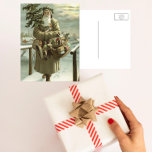 Vintage Christmas, Victorian Santa Claus with Toys Feiertagspostkarte<br><div class="desc">Vintage illustration Christmas holiday design featuring a Victorian Santa Claus walking through the snow leaving footprints. He is carrying a Christmas tree and a basket of toys on a cloudy evening with the moon shining through the clouds. Originally a Scandinavian postcard with the text: God Jul or Merry Christmas.</div>
