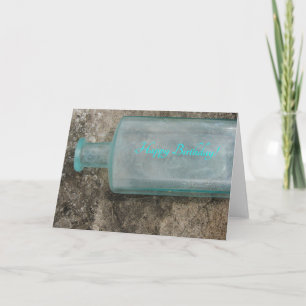 Vintage Glasflasche auf versteinertem Karte