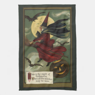 Vintage-Halloween-Hexe auf einem Besenstiel mit Ka Handtuch