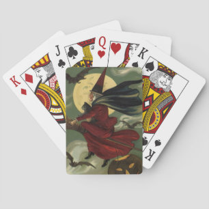Vintage-Halloween-Hexe auf einem Besenstiel mit Ka Spielkarten