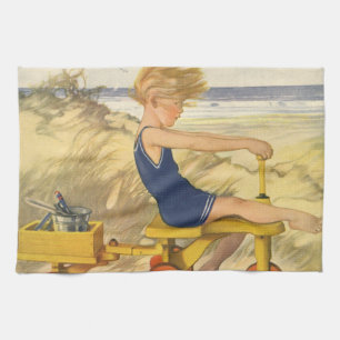 Vintage Junge spielt am Strand mit Sandspielzeug Geschirrtuch