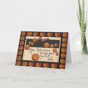 Vintage lächelnde Halloween-Kürbislaternen Karte