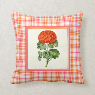 Vintage orange Pelargonie mit karierter Kissen