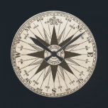 Vintage Rose Runde Wanduhr<br><div class="desc">Eine Vintage Kompass-Rose in Sepia auf einem Pergament getönt antiquierten Hintergrund. Das Zentrum liest "Mariner-Kompass". Zählen Sie die Zeit, während die Hände über die Richtungen des Kompasses gehen. Nord ist um 12:00 Uhr. Ein fantastisches Geschenk für einen Agent, Schiffskapitän oder Weltreisenden.</div>