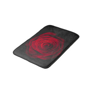 Vintage rote Rose auf schwarzem Hintergrund Badematte