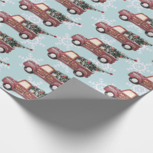 Vintage roter Spielzeug-LKW mit einem Weihnachtsba Geschenkpapier