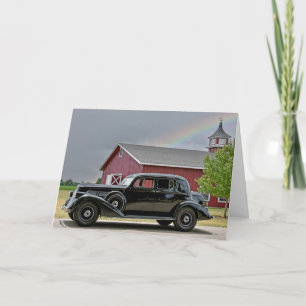 Vintage schwarzes Auto mit Regenbogen Karte