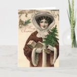 Vintage Victorian Lady Christmas Card Feiertagskarte<br><div class="desc">Beautiful Vintage image of a Victorian lady, out in the crisp, white snow doing some Holiday shopping and picking up her Christmas Tree, with the greeting MERRY CHRISTMAS. Interior says simply MERRY CHRISTMAS AND A HAPPY NEW YEAR. Inside left is blank for you to write a Christmas note to your...</div>