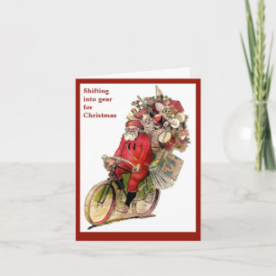 Vintage-Weihnachtsbild von Santa auf einem Fahrrad Feiertagskarte